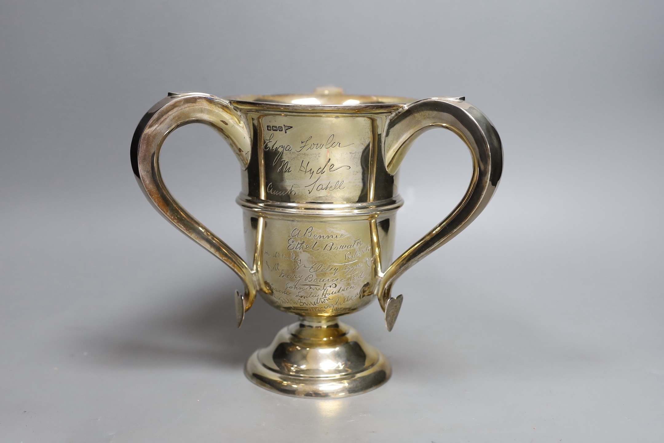 A George V silver tyg, with engraved signatures throughout, Walker & Hall, Sheffield, 1913, height 18.9cm, 23.2oz.